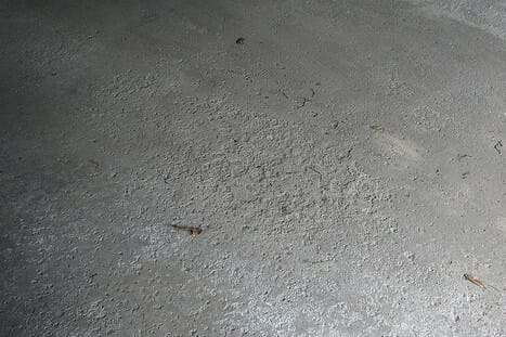 spalled-pitted-garage-floor