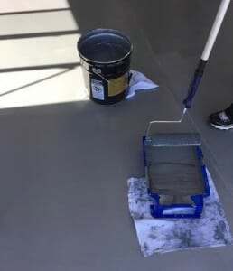 Applying Rust Bullet garage floor paint