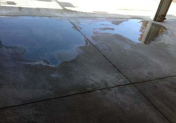 Fix Low Spots In Your Garage Floor, How To Fix A Concrete Patio That Holds Water