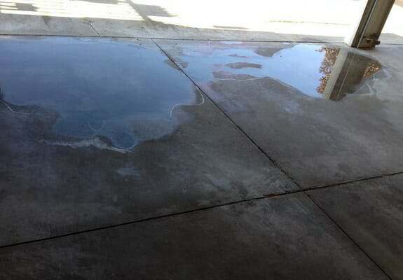 garage floor low spots fix water level floors puddle spot puddles repair fixing flooring