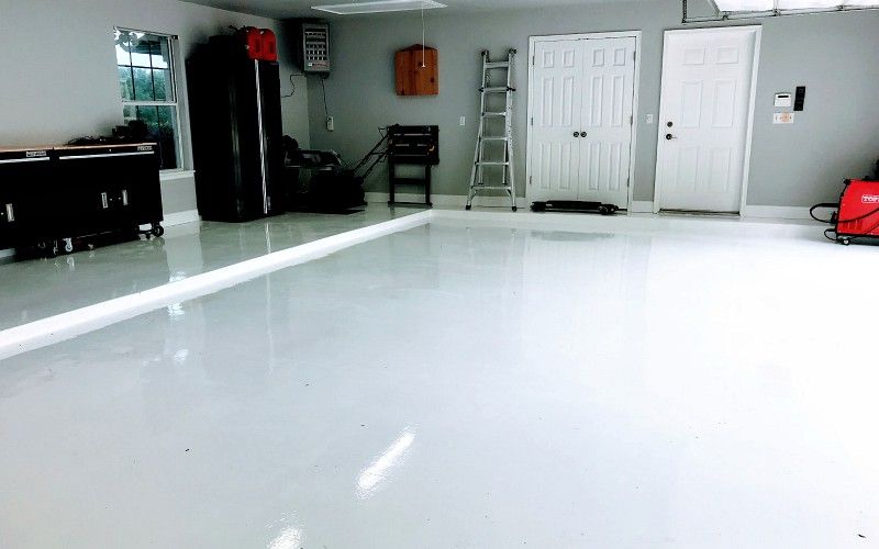 White is always a good option! Solid epoxy floor !